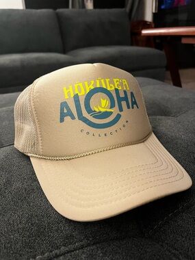 ALOHA Collection Tan Trucker Hat with Blue and Yellow Logo